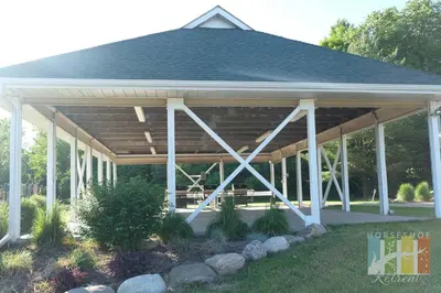 a pavilion with white columns and a roof at Horseshoe Retreat in Edgar