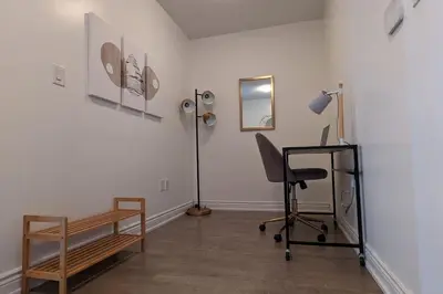a room with a desk and a chair and a lamp at Lovely 2 Bed Condo in Downtown Toronto in Toronto