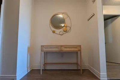 a dressing table with a mirror on a wall at Lovely 2 Bed Condo in Downtown Toronto in Toronto