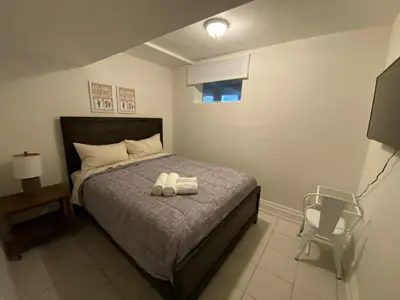 a bedroom with a bed with two towels on it at Yorkmills and Bayview !C Cozy & Stylish Private Bdr with Shared Bathroom in Toronto