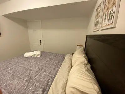 a bedroom with a bed with two towels on it at Yorkmills and Bayview !C Cozy & Stylish Private Bdr with Shared Bathroom in Toronto