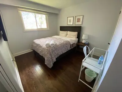 a small bedroom with a bed and a window at Yonge and Finch Subway !P Cozy & Quiet Private Bdr with Private Bathroom in Toronto
