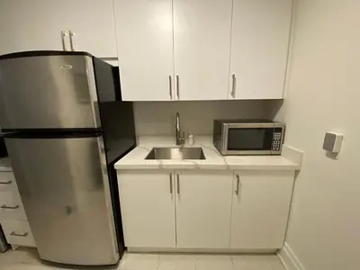 a kitchen with a refrigerator and a sink and a microwave at Yorkmills and Bayview !B Spacious and Stylish Private Bdr with Shared Bathroom in Toronto