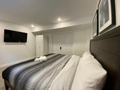 a bedroom with a bed with two stuffed animals on it at Yorkmills and Bayview !A Spacious and Modern Private Bdr with Shared Bathroom in Toronto