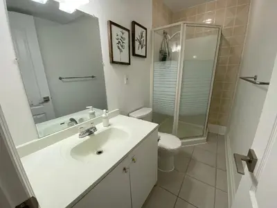 a bathroom with a sink and a shower and a toilet at Yorkmills and Bayview !A Spacious and Modern Private Bdr with Shared Bathroom in Toronto