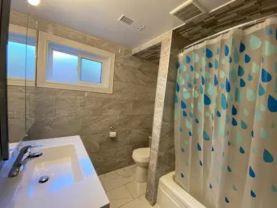 a bathroom with a sink and a toilet and a shower at Yonge and Finch Subway !R Spacious & Stylish Prvt Bdr with Shared Bathroom in Toronto
