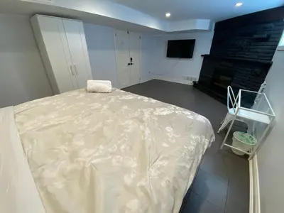a room with a bed and a fireplace at Yonge and Finch Subway !R Spacious & Stylish Prvt Bdr with Shared Bathroom in Toronto