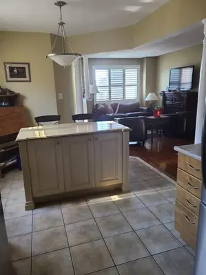 a kitchen and living room with a island in the middle at Top Floor of House in S Vaughan All to Yourself in Vaughan