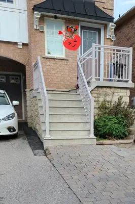 a house with stairs leading to a door with a spider on it at Top Floor of House in S Vaughan All to Yourself in Vaughan