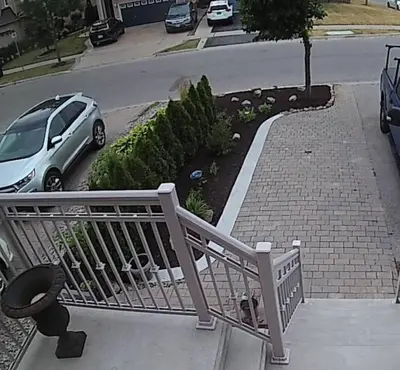 a white car parked on the side of a street at Top Floor of House in S Vaughan All to Yourself in Vaughan