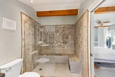 a bathroom with a shower and a toilet at Marmora Retreat - Unique Waterfront Farmhouse in Marmora