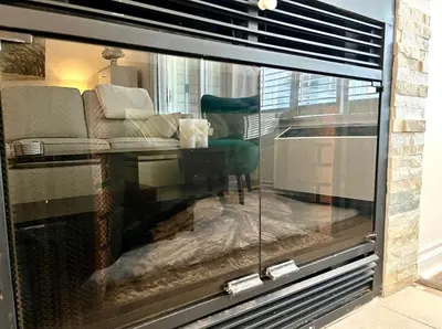 a window with a couch and a chair in a room at Slope-side Studio Bliss Ski-in Ski-out, Renovated At Blue, Hot Tub, Fast Wi-Fi in Blue Mountains