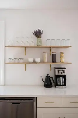 a kitchen counter with shelves and a coffee maker at The Darcie House - cozy, pet-friendly home in PEC in Picton