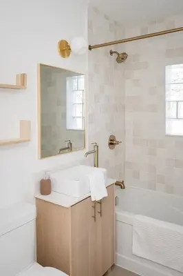 a bathroom with a sink and a tub and a toilet at The Darcie House - cozy, pet-friendly home in PEC in Picton