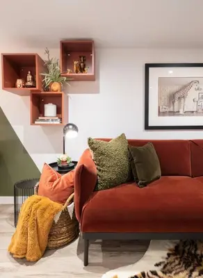 a living room with a red couch and a table at Professionally Designed 1-Bedroom in Prime Toronto in Toronto