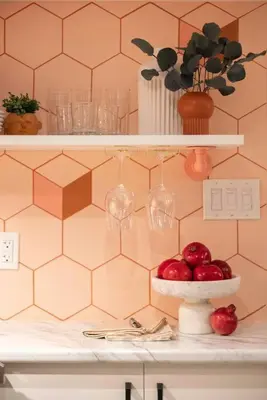 a counter with a bowl of apples on a shelf at Professionally Designed 1-Bedroom in Prime Toronto in Toronto