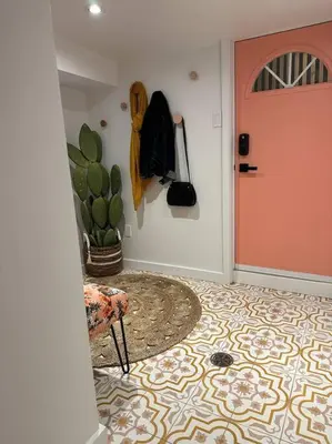 a hallway with a room with a door and a plant at Professionally Designed 1-Bedroom in Prime Toronto in Toronto