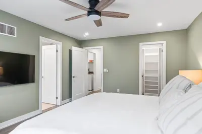 a bedroom with a bed and a ceiling fan at Jewel of Blue Mountain - Walk to Ski and Village - EV plug in Blue Mountains