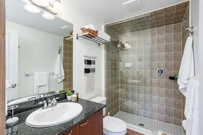 a bathroom with a sink and a shower at The Parker House Gorgeous Light and Spacious Chalet 86100 in Blue Mountains