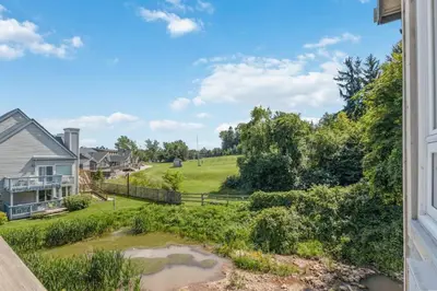 a view of a yard from a house at Blue Mountain The Parker Slopeside in Blue Mountains