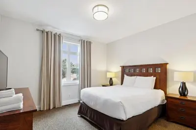 a bedroom with a large bed and a window at Blue Mountain Retreat at Rivergrass in Blue Mountains