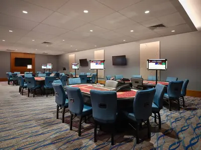 a conference room with a long table and chairs at Great Blue Heron Hotel in Port Perry