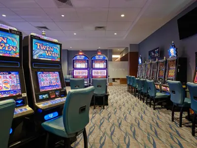 a casino with many slot machines in a room at Great Blue Heron Hotel in Port Perry