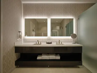 a bathroom with a sink and a large mirror at Pickering Casino Resort in Pickering