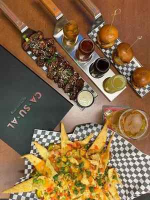 a table with two trays of food with chips and drinks at Pickering Casino Resort in Pickering