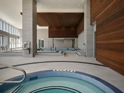 a swimming pool in a building with a building at Pickering Casino Resort in Pickering