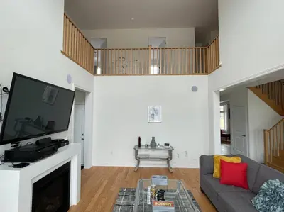 a living room with a couch and a tv at Rest in Quinte West - 25 mins from Batawa Ski Hill in Carrying Place