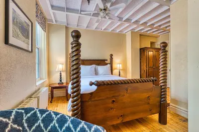 a bedroom with a canopy bed in a room at The Stratford Hotel by Hoco Hotels Collection in Stratford