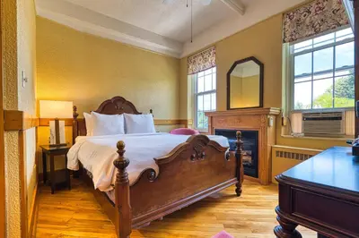 a bedroom with a large bed and a mirror at The Stratford Hotel by Hoco Hotels Collection in Stratford