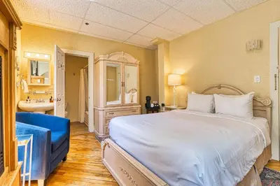 a bedroom with a large bed and a bathroom at The Stratford Hotel by Hoco Hotels Collection in Stratford