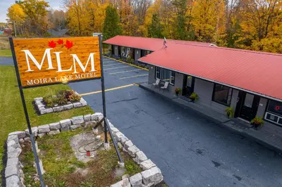 a mcdonalds sign in front of a parking lot at Moira Lake Motel in Madoc