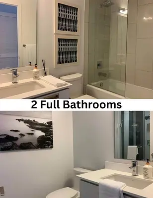 a bathroom with a sink and a toilet and a mirror at Stunning Stayz Luxury 2 King Suite at Friday Harbour Resort Marina Walk & Parking in Innisfil