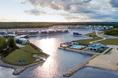 an aerial view of a resort on a river at Stunning Stayz Luxury 2 King Suite at Friday Harbour Resort Marina Walk & Parking in Innisfil