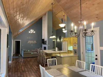 a kitchen and living room with a table and chairs at WELCOME TO BURNT RIVER ESTATE in Kawartha Lakes