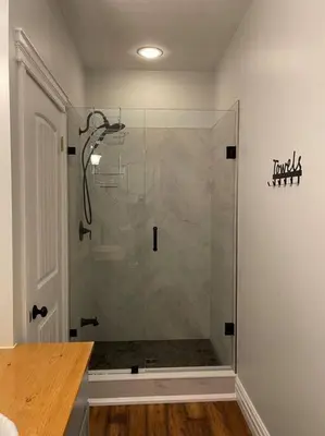 a bathroom with a shower with a glass door at WELCOME TO BURNT RIVER ESTATE in Kawartha Lakes