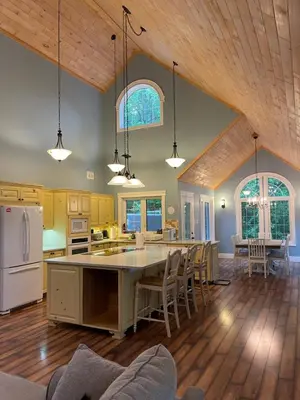 an open kitchen and dining room with a table and chairs at WELCOME TO BURNT RIVER ESTATE in Kawartha Lakes