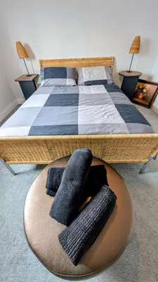 a bedroom with a bed with two pillows on it at Exclusive Townhome near West-Side Trails in Waterloo