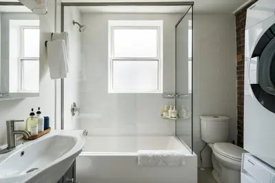 a bathroom with a tub and a sink and a toilet at 