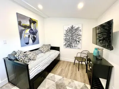 a small room with a bed and a desk at 