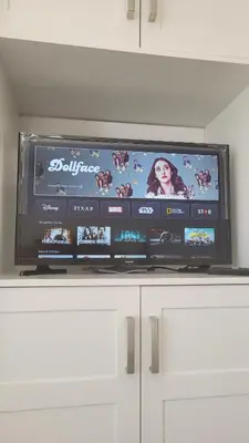 a flat screen tv sitting on top of a cabinet at Private Suite in Forest Hill with full kitchen and parking in Toronto