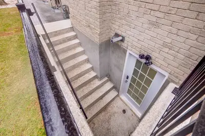 a set of stairs with a door on a building at Vacation Suite in Pickering in Pickering
