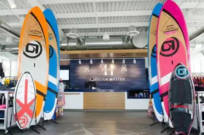 a group of surfboards on display in a store at PET FRIENDLY CONDOS at FRIDAY HARBOUR in Innisfil