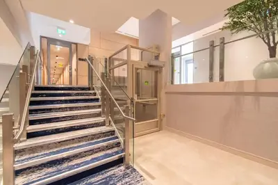 a staircase in a building with a stair case at PET FRIENDLY CONDOS at FRIDAY HARBOUR in Innisfil
