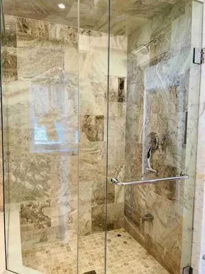 a shower with a glass door in a bathroom at SouthLake Cottage on The Lake. in Washago