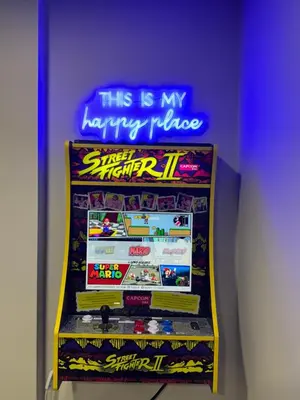 a frisbee machine with a sign that says this is my happy place at Modern 4 Level home-Game room/Parking/Near Airport in Mississauga