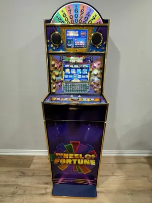 a pinball machine with a laptop on top of it at Modern 4 Level home-Game room/Parking/Near Airport in Mississauga